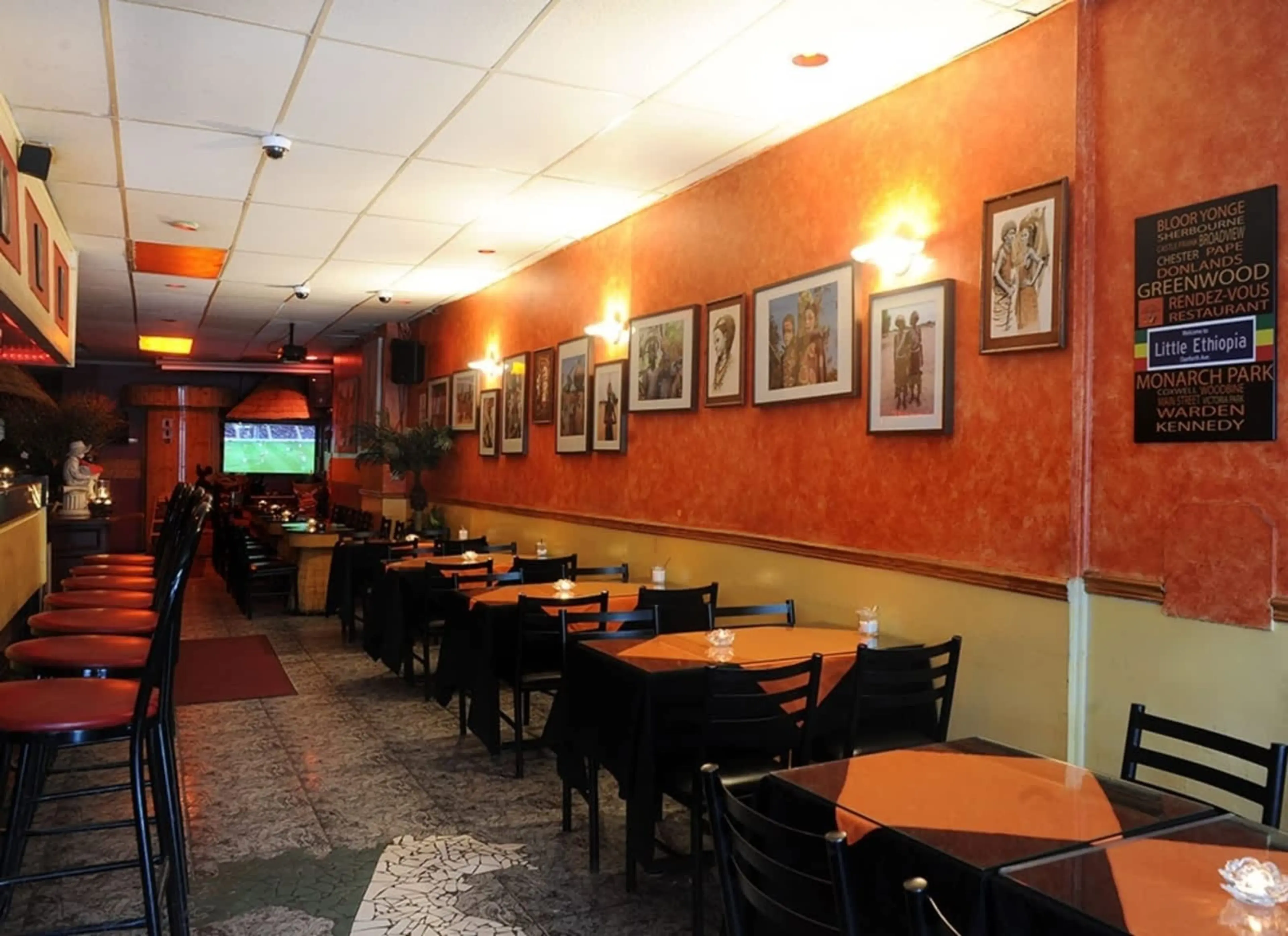 Warmly lit dining room at Rendez-Vous Ethiopian and Eritrean Restaurant